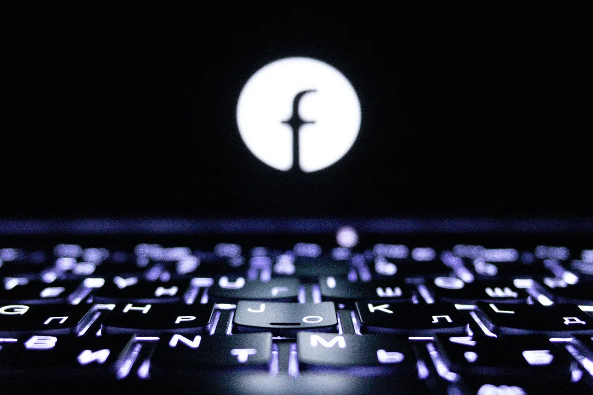 Close-up of a glowing keyboard with a symbol, creating a tech-focused ambiance. Close-up of a glowing keyboard with a symbol, creating a tech-focused ambiance.