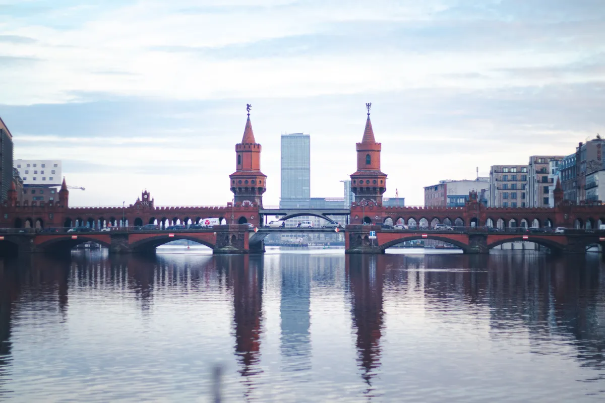 Beautiful reflection of Oberbaum Bridge on the River Spree at dusk in Berlin, Germany.